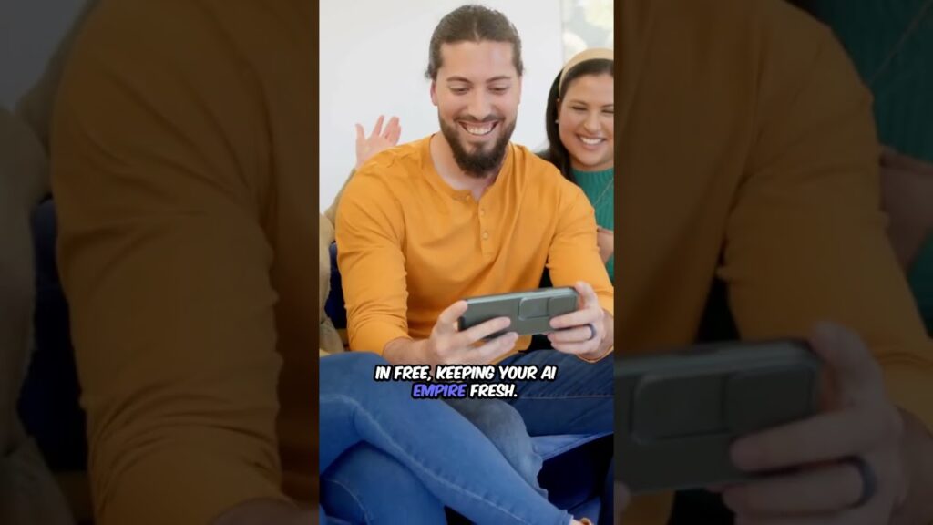 Man with a beard wearing an orange shirt, smiling while holding a smartphone, with two people in the background.
